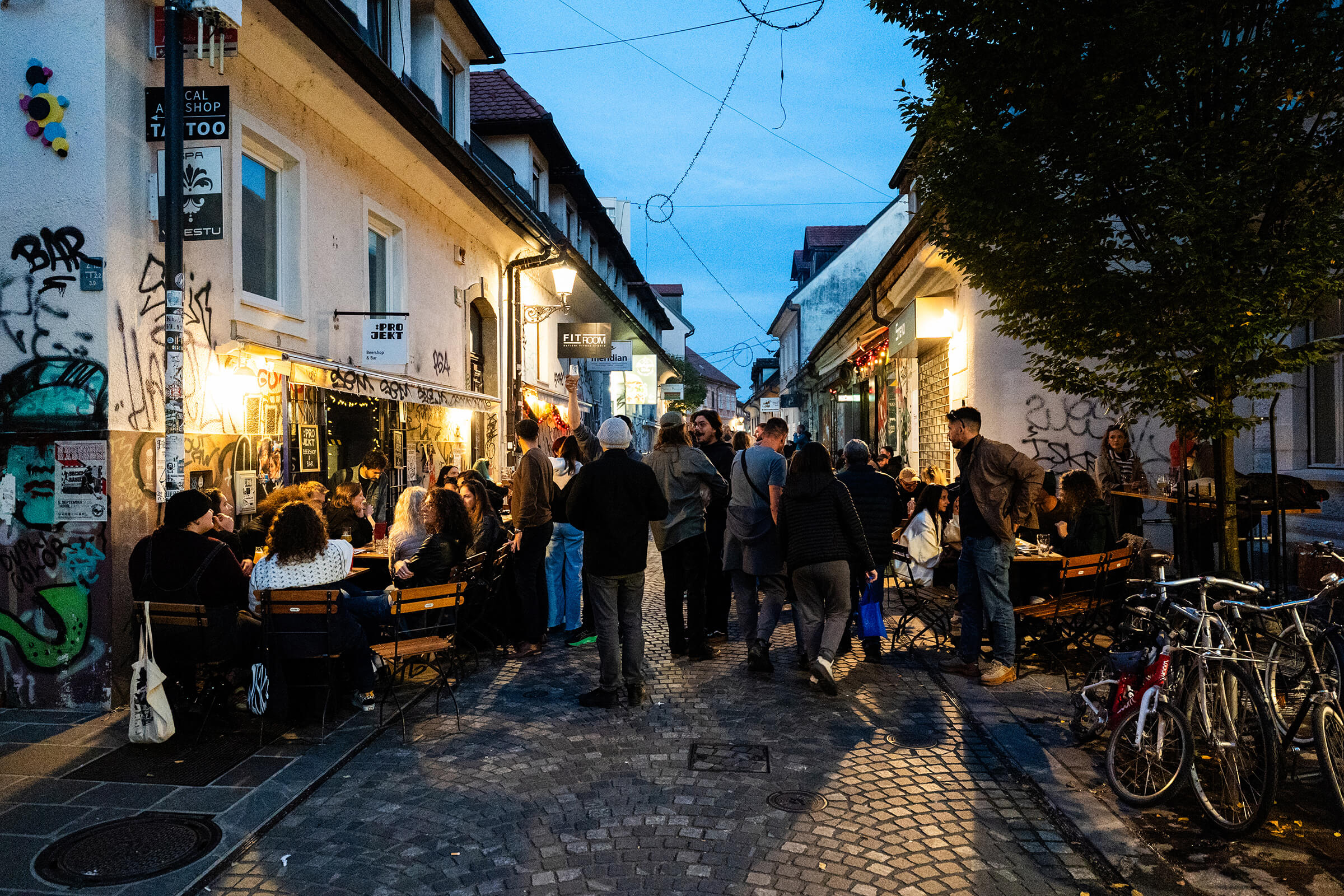 Street full of people outside :Projekt at blue hour during the Folk Hero grand opening